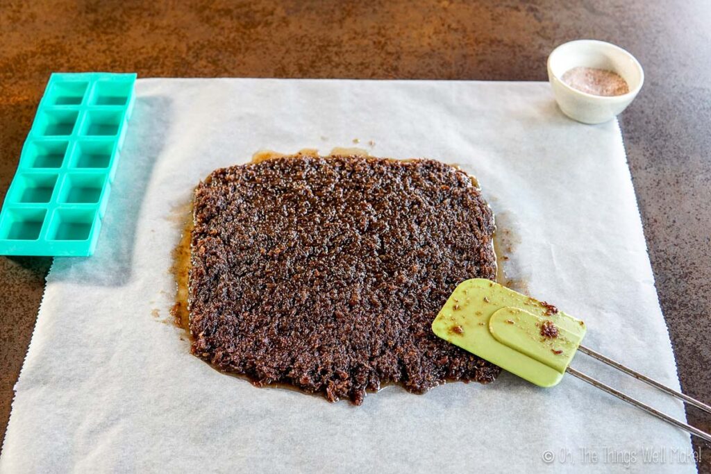 spreading the pemmican mixture over parchment paper