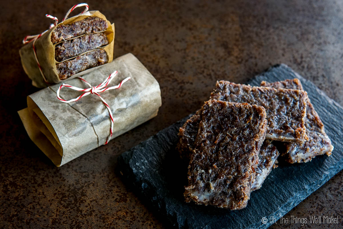 pemmican meat bars on a tray and wrapped in paper