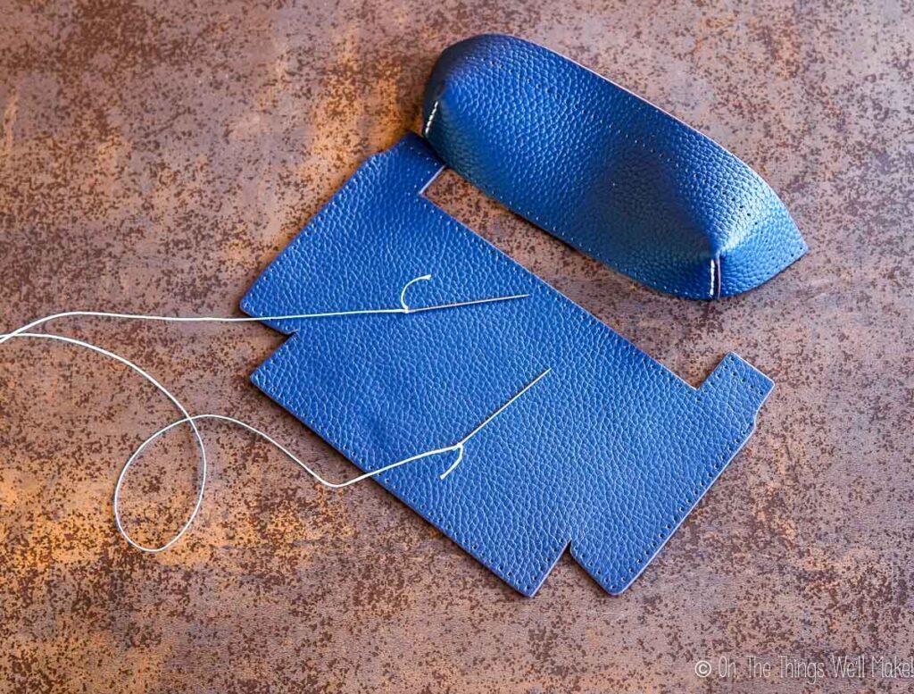sewing the edges of the leather pocket