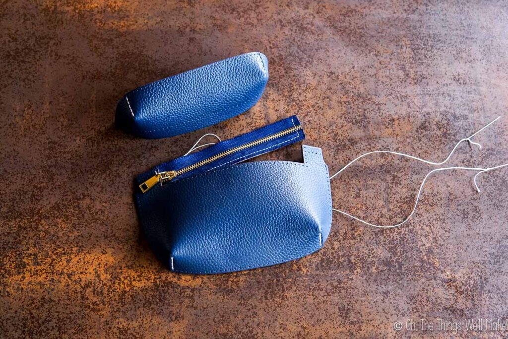 sewing the zipper onto the pocket pieces.