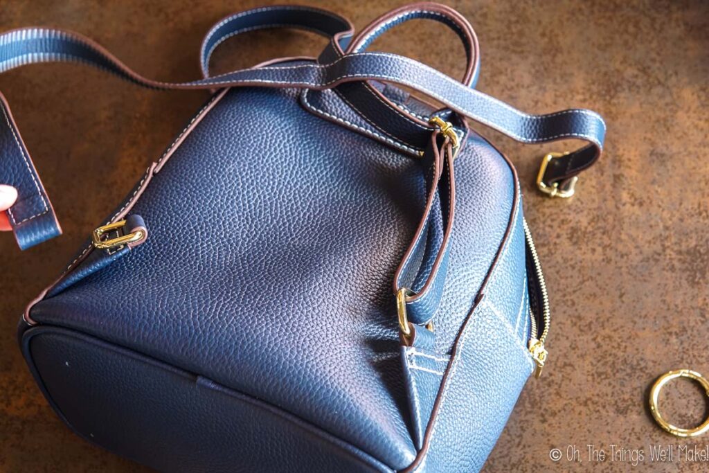 fastening the straps to the backpack