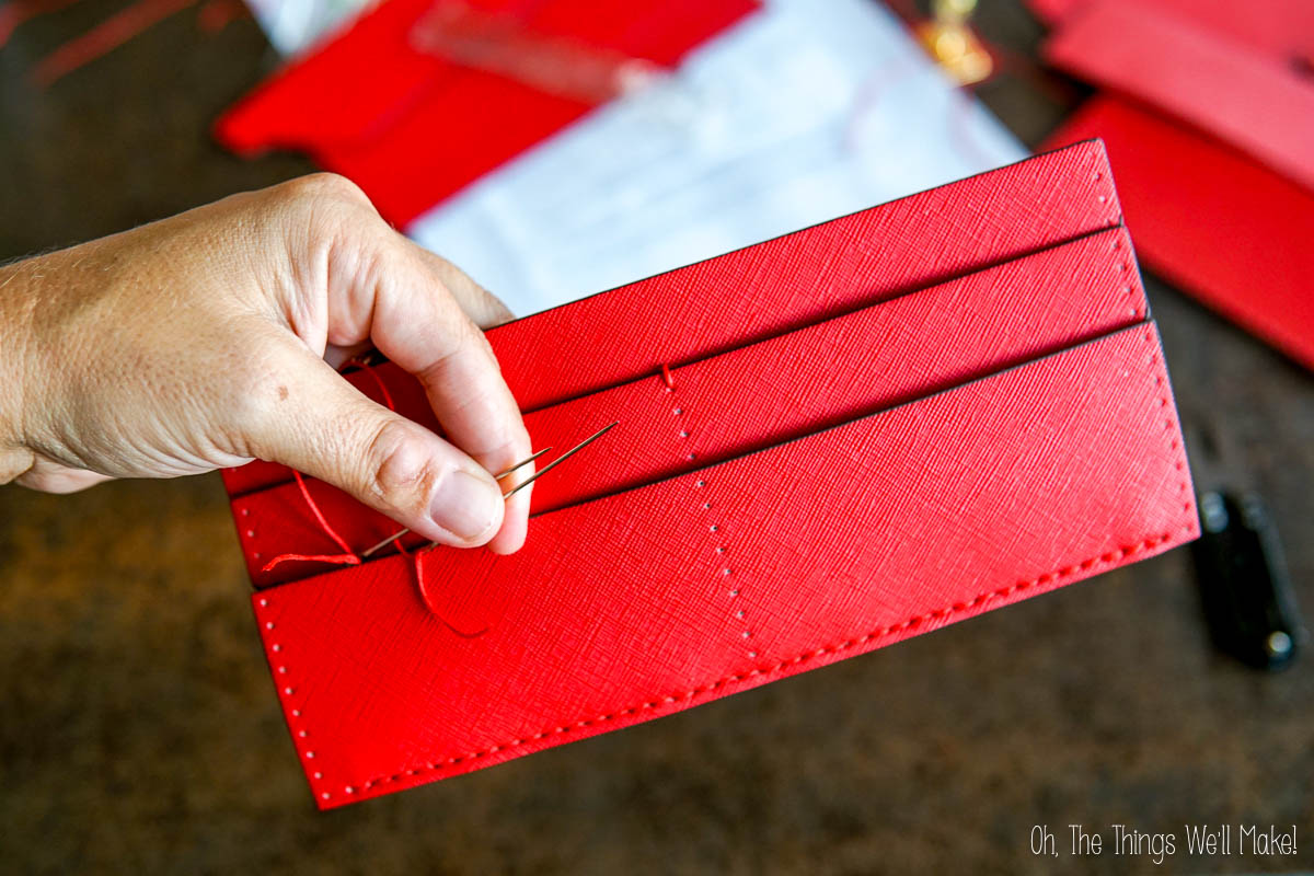 closeup of the first stich in the center of the card section.